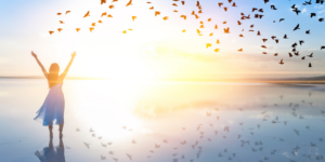 Free woman surrounded by birds