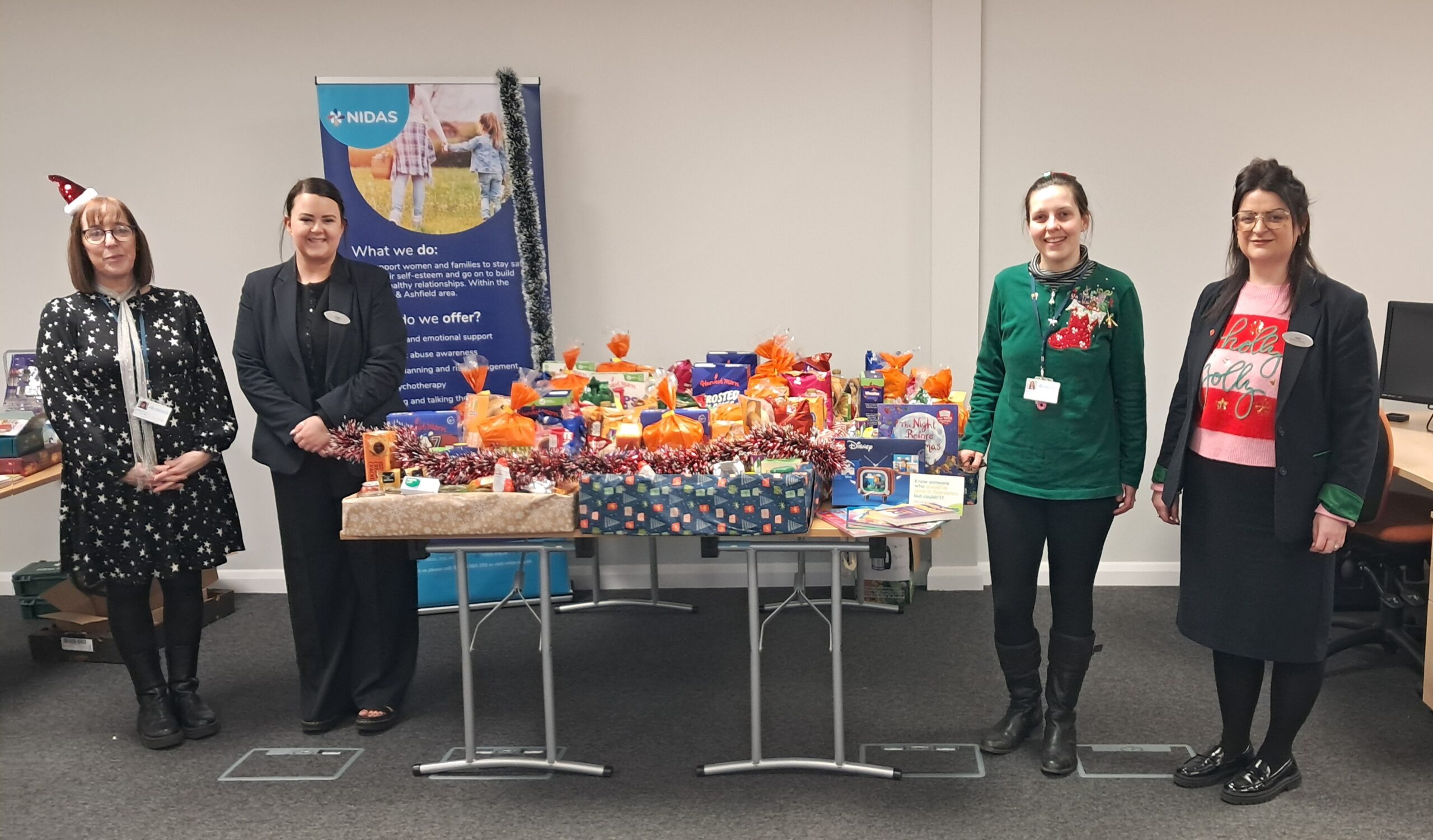 Specsavers christmas donations to local charity NIDAS Nottingham domestic abuse